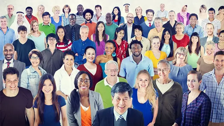 A diverse group of employees collaborating around a table in an office